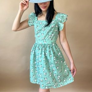 Green floral ruffle strap backless dress with bow